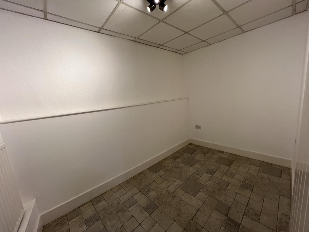 Lot: 41 - THREE STOREY COMMERCIAL PROPERTY - General view of the store room at back of retail area
